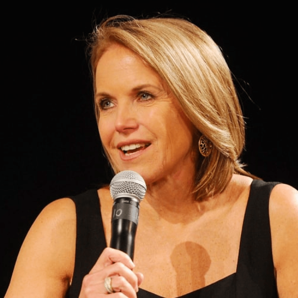 Story author, Katie Couric, holding microphone