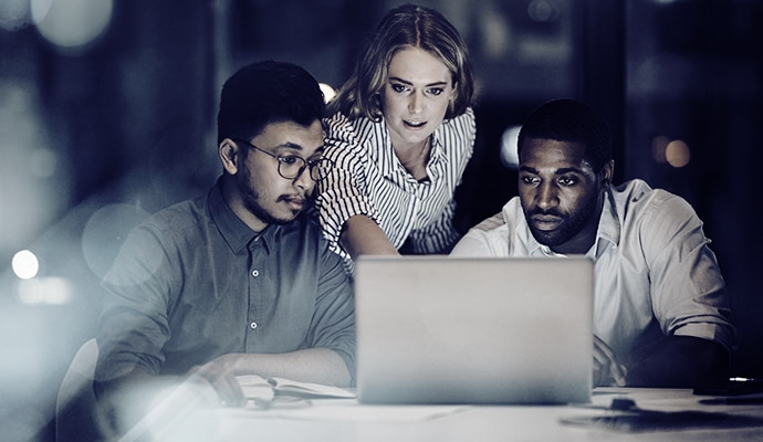 people working together at a laptop