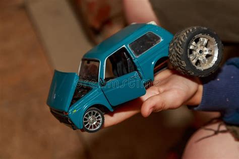 Broken Toy Car in the Hands of a Child. Poverty and Misery Stock Image ...