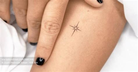 Minimalist north star tattoo on the inner forearm.