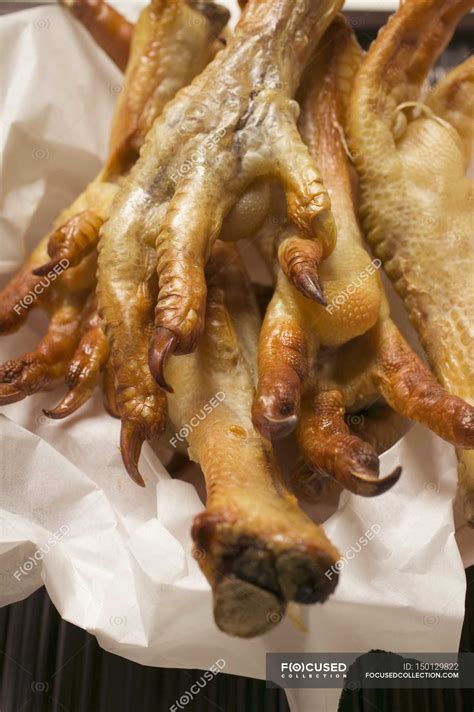 Deep-fried chicken feet — close up, appetite - Stock Photo | #150129822