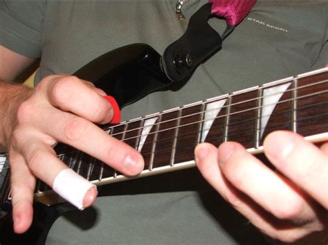 ¿cómo tocar el tapping en la guitarra?