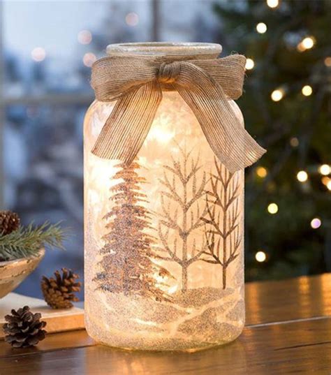 a lighted jar with a christmas tree inside