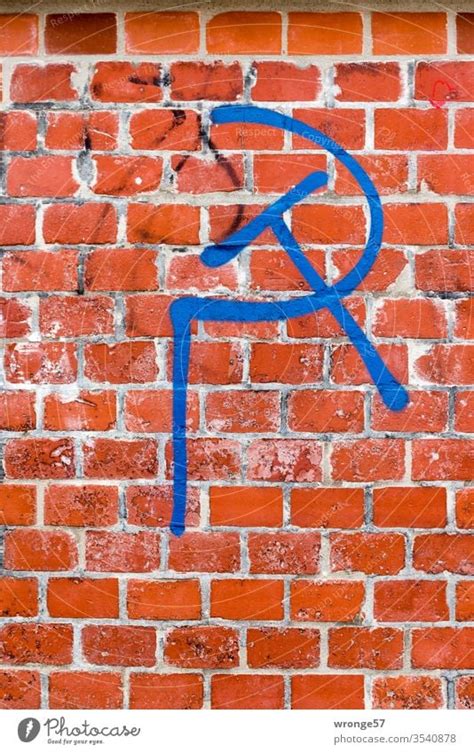 Hammer and sickle graffiti on white wall - a Royalty Free Stock Photo ...