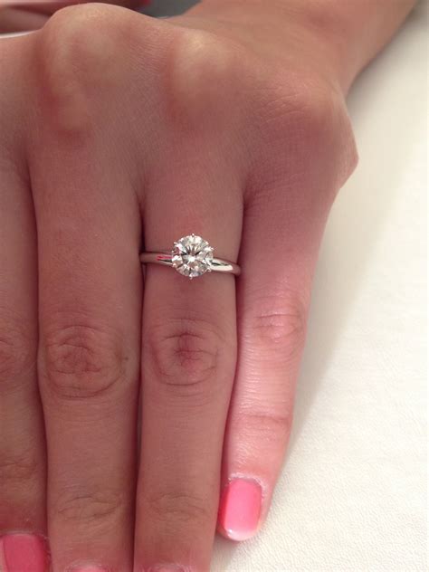 Something about a round solitaire ring is just simply beautiful. Never ...