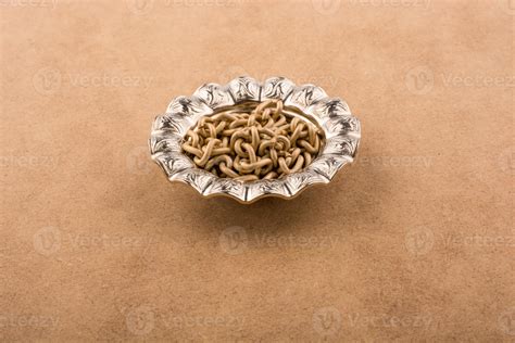 Fake gold coins in a metal plate 14537155 Stock Photo at Vecteezy