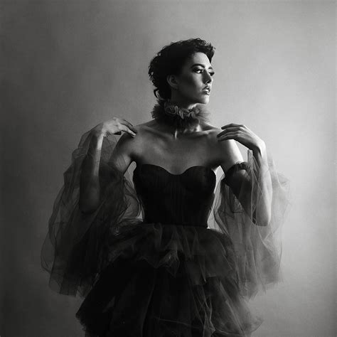 Classic studio fashion editorial on black and white film with a tulle dress