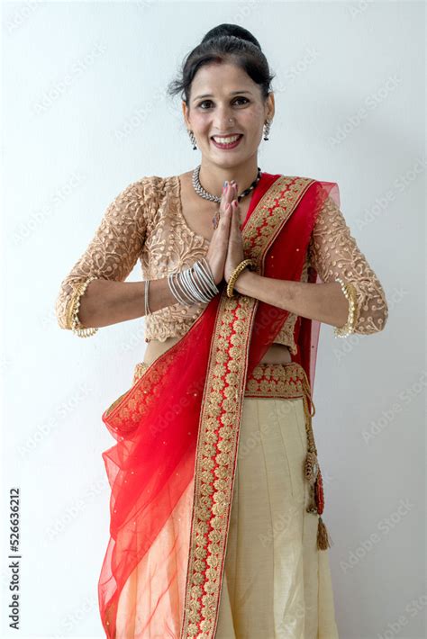 Indian or Nepali beautiful woman doing traditional gesture for welcome ...