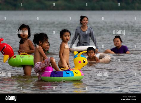 Don Daeng, Laos - April 27, 2018: Local people swimming in the Mekong ...