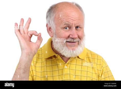 senior funny bald man in yellow t-shirt is shows gestures and grimaces ...