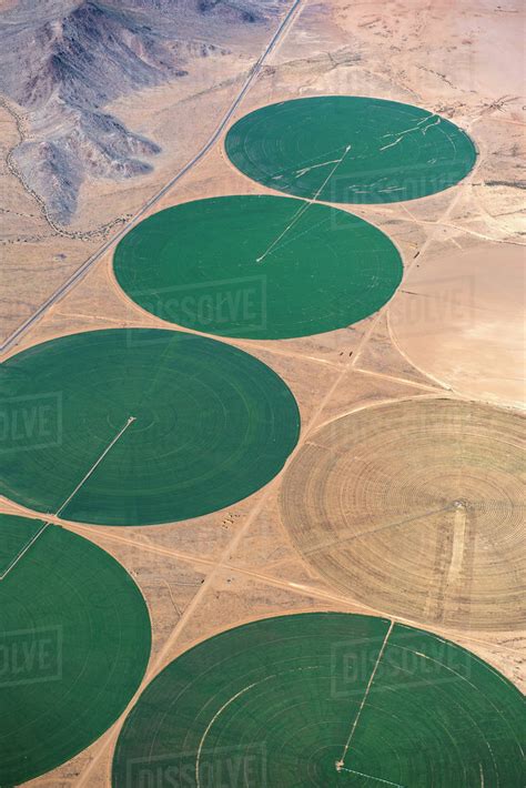 Aerial view of farm land in rural landscape - Stock Photo - Dissolve