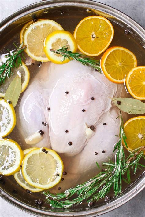 A fresh turkey immersed in brine made with salt, water, vinegar, garlic ...