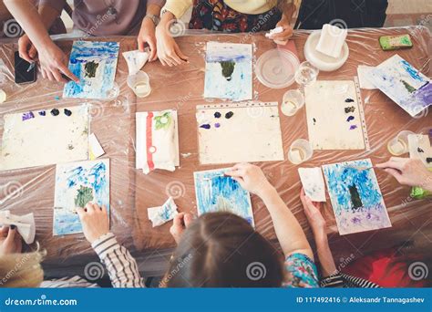 Group Drawing with Paints Sitting at the Table Stock Photo - Image of ...