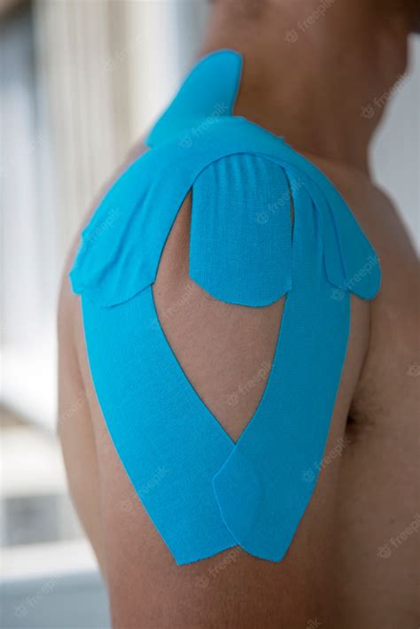 Premium Photo | Adhesive bandage on shoulder