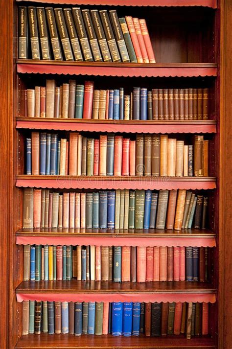 Old bookshelf in ancient library. Bookshelf with a lot of old books in ...