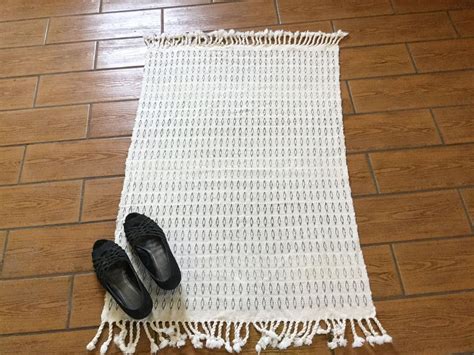 Handwoven in shades of gray this natural cotton rug is washable. It is ...