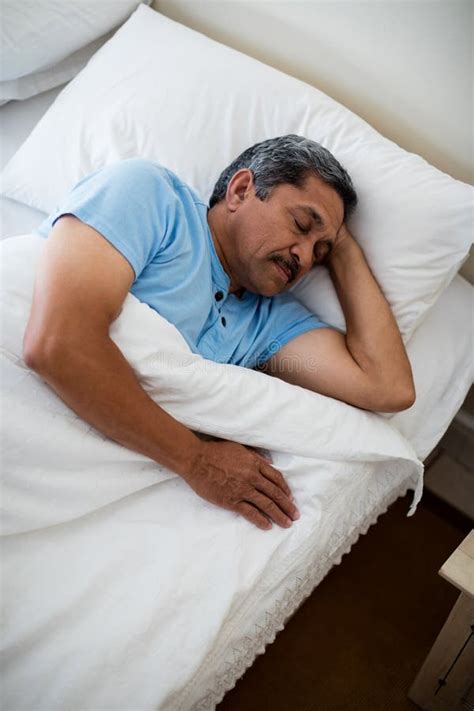 Senior Man Sleeping on Bed in Bedroom Stock Photo - Image of pillow ...