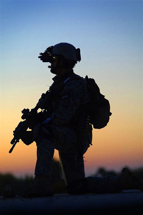 U.S. Army Ranger stands watch while on patrol in Iraq. This Ranger is ...