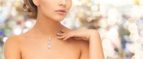 Woman wearing shiny diamond pendant Stock Photo by ©Syda_Productions ...