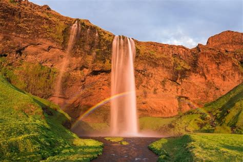 Premium Photo | Seljalandsfoss waterfall with a rainbow in iceland