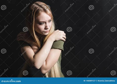 Sad Young Woman Going To Cry in a Black Background Stock Image - Image ...