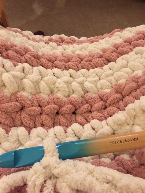 Making a blanket with Bernat Blanket Big yarn! I feel like I'm using a ...