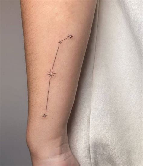 Aries constellation tattoo on Laura Escanes' wrist.