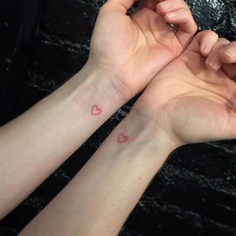 Individual matching red heart tattoos. | Red heart tattoos, Red ink ...