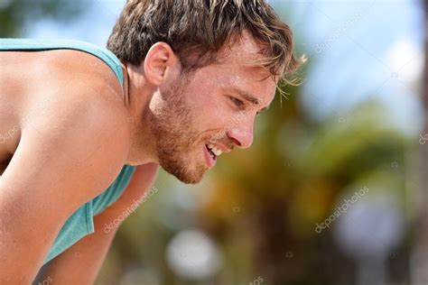 Tired man runner sweating after workout — Stock Photo © Maridav #72655153