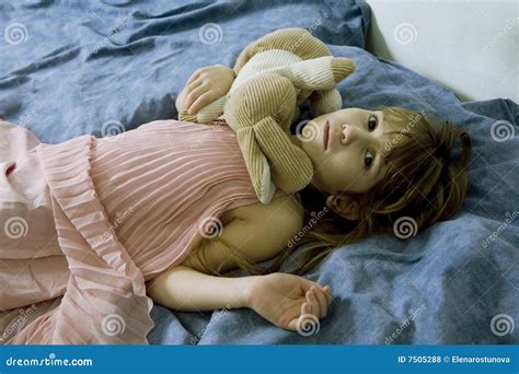 Desperate Little Girl Lying on the Bed Stock Photo - Image of heart ...