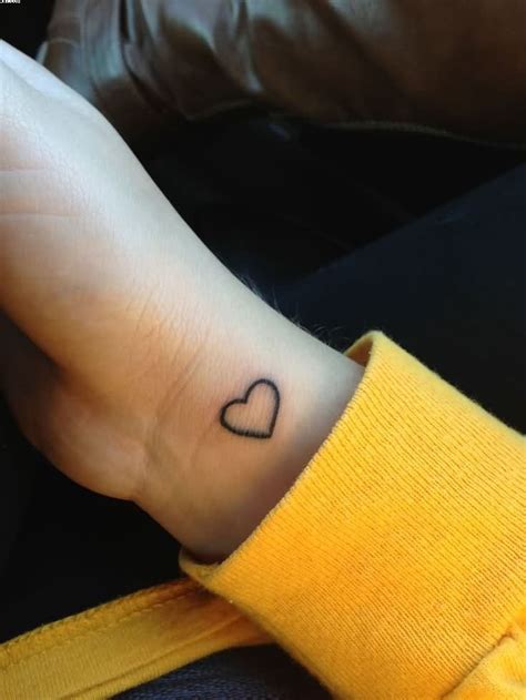 cute outline heart wrist tattoo cute heart tattoo on hands | Hand heart ...