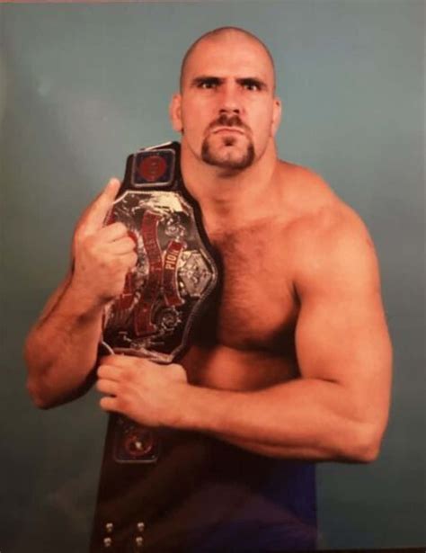 Download Nikita Koloff With His Belt On Shoulder Wallpaper | Wallpapers.com