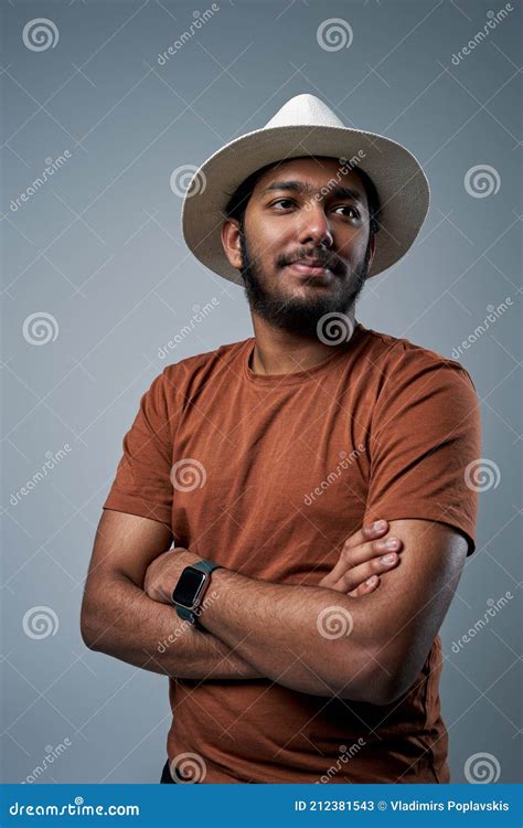 Fashionable Hindu with Hat and Modern Watch in Gray Background Stock ...