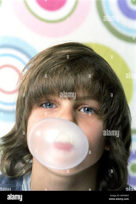 young boy blowing bubblegum Stock Photo - Alamy