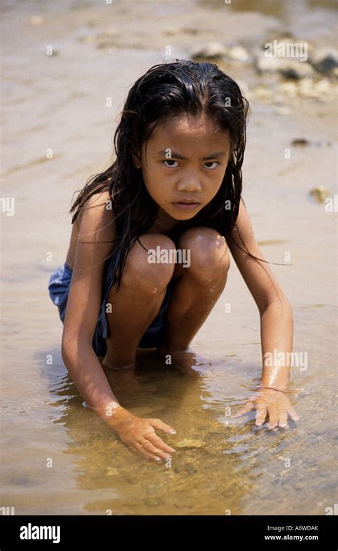 Girl playing in a river, Vang Vieng, Laos Stock Photo - Alamy