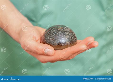 Massage Stone in Hand of Man Stock Photo - Image of care, fingers ...