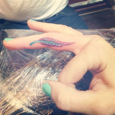 Pin by Ashley Senoski on Tattoos | Feather tattoos, Finger tattoo for ...