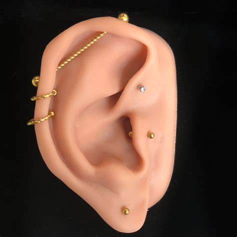 Curated ear with gold ear piercing jewelry | Upper ear earrings ...