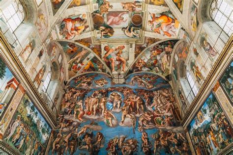 the ceiling of an ornate building with paintings on it