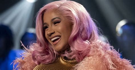 Cardi B retaliates, throws microphone at fan who doused her with a ...