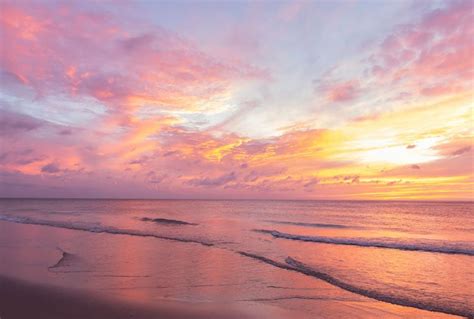 Pink sunrise sky over the ocean | Beach sunset wallpaper, Landscape ...