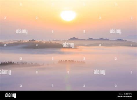 Sunrise from sea of clouds Stock Photo - Alamy