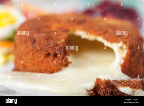 breaded camembert with salad on wood Stock Photo - Alamy