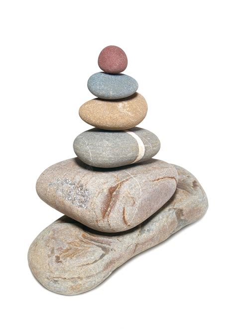 Premium Photo | Pyramid of stones isolated on white.