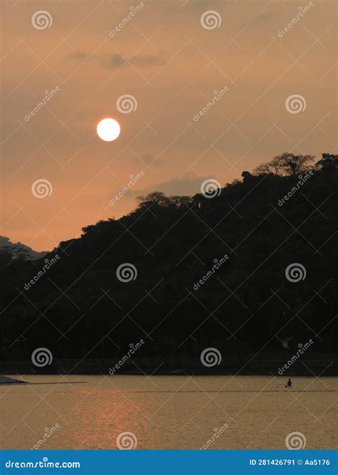 Silhouette in the Sunset by the River Stock Image - Image of white ...