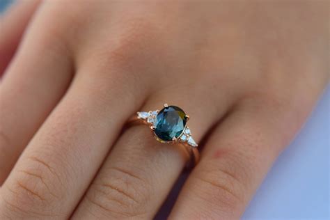 Teal sapphire engagement ring. Peacock green sapphire 3.1ct oval ...