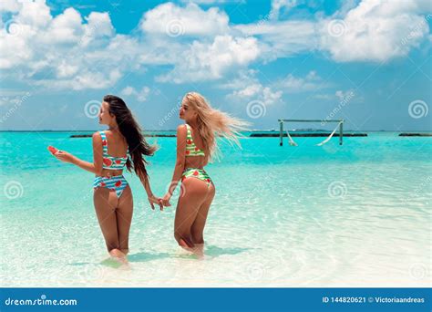 Two Bikini Models Having Fun on Tropical Beach, Exotic Maldives Island ...