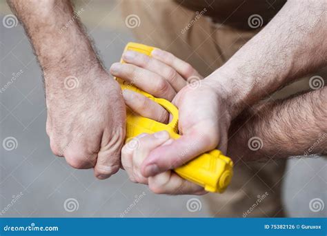 Gun Disarm. Self Defense Techniques Against a Gun Point. Stock Photo ...