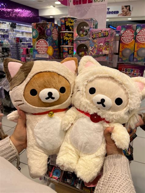 two stuffed animals are on display in a store