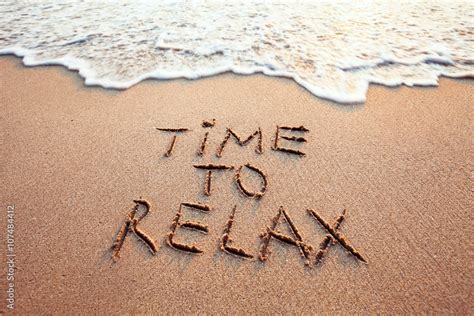 time to relax, concept written on sandy beach Stock Photo | Adobe Stock